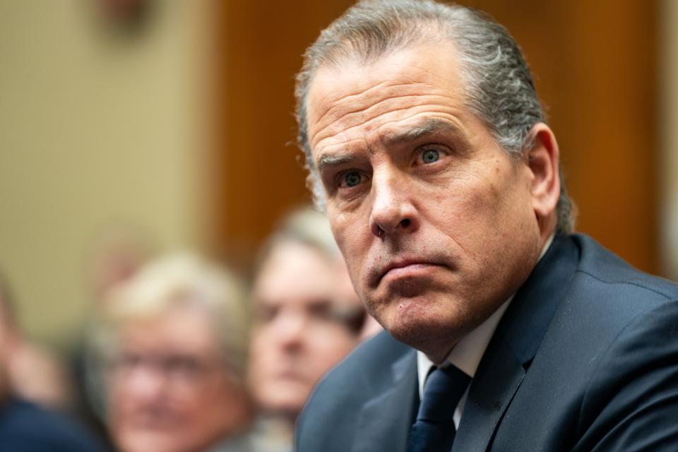 Hunter Biden, son of President Joe Biden, flanked by Kevin Morris, left, and Abbe Lowell, right, attend a House Oversight Committee meeting on Jan. 10 in Washington. The committee is meeting today as it considers citing him for Contempt of Congress.