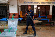 <p>A Nepalese policeman stands guard in front of sealed ballot boxes awaiting transportation, after the completion of the local election of municipalities and villages representatives in Kathmandu, Nepal, May 14, 2017. (Photo: Navesh Chitrakar/Reuters) </p>