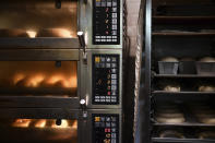 Pastries are cooked inside the oven at Babushka Artisanal Bakery in Budapest, Hungary, Friday, Sept. 9, 2022. The gourmet bakery has raised its prices by 10% to keep up with rapidly rising costs of energy and raw materials, and taken steps to moderate its use of electricity to avoid having to close down. (AP Photo/Anna Szilagyi)