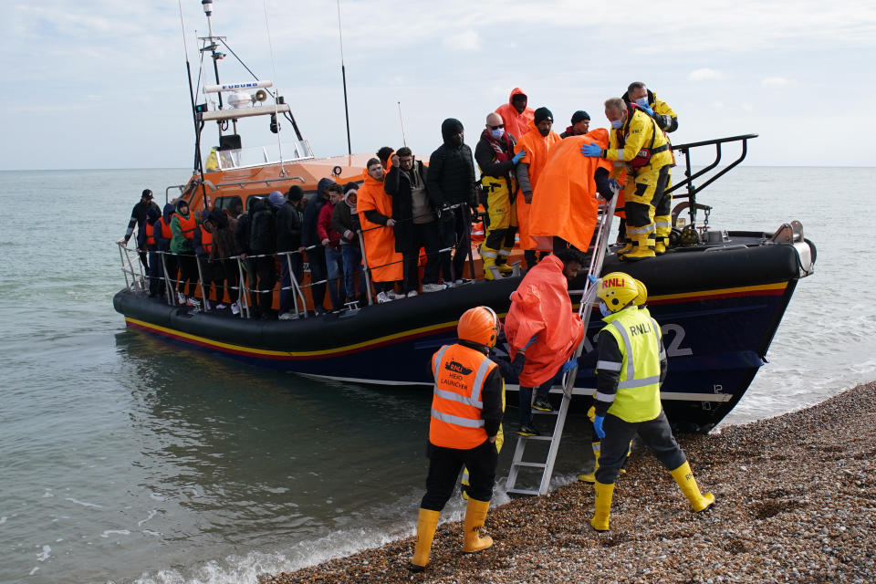 A group of people thought to be migrants are brought in to Dungeness beach by the Dungeness lifeboat following a small boat incident in the Channel. Picture date: Wednesday October 12, 2022.