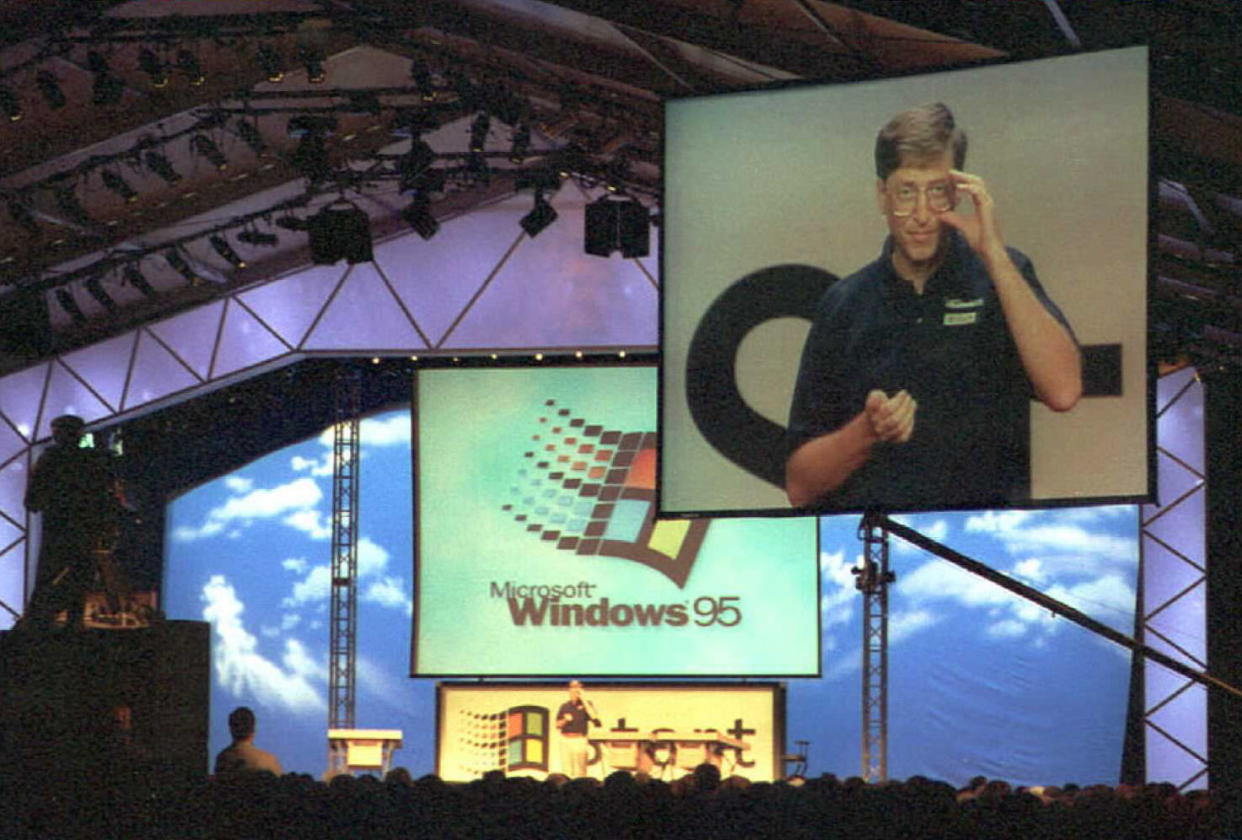 Bill Gates launches Windows 95 on the big screen at Microsoft's Redmond, Washington on August 25, 1995. (Getty)