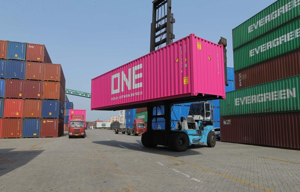 LIANYUNGANG, CHINA - JUNE 03: A worker unloads a shipping container at Lianyungang Port on June 3, 2019 in Lianyungang, Jiangsu Province of China. (Photo by Wang Jianmin/VCG)