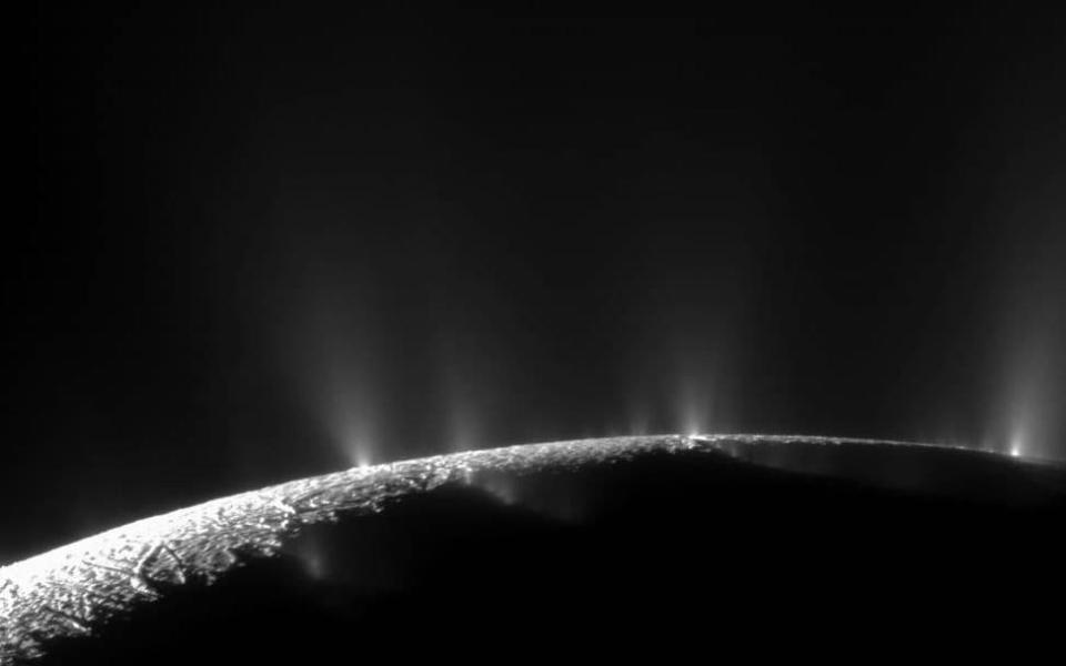 Plumes of vapour shooting up from Enceladus' ocean  - Credit: Nasa 