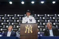 New York Yankees' Aaron Judge, center, speaks while owner Hal Steinbrenner, left, and president Randy Levine look on during a baseball news conference at Yankee Stadium, Wednesday, Dec. 21, 2022, in New York. Judge has been appointed captain of the New York Yankees after agreeing to a $360 million, nine-year contract to remain in pinstripes. (AP Photo/Seth Wenig)