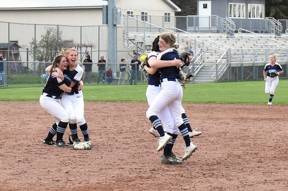 Grace Scanlon (ball in hand) gets a hug from Central Valley Academy first baseman Kaylee Beam after making a catch for the final out against the Camden Blue Devils Thursday, May 5, 2022, at Lower Tolpa in Mohawk, New York.