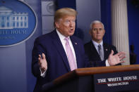 President Donald Trump speaks during a coronavirus task force briefing at the White House, Saturday, April 4, 2020, in Washington. Vice President Mike Pence listens at left. (AP Photo/Patrick Semansky)