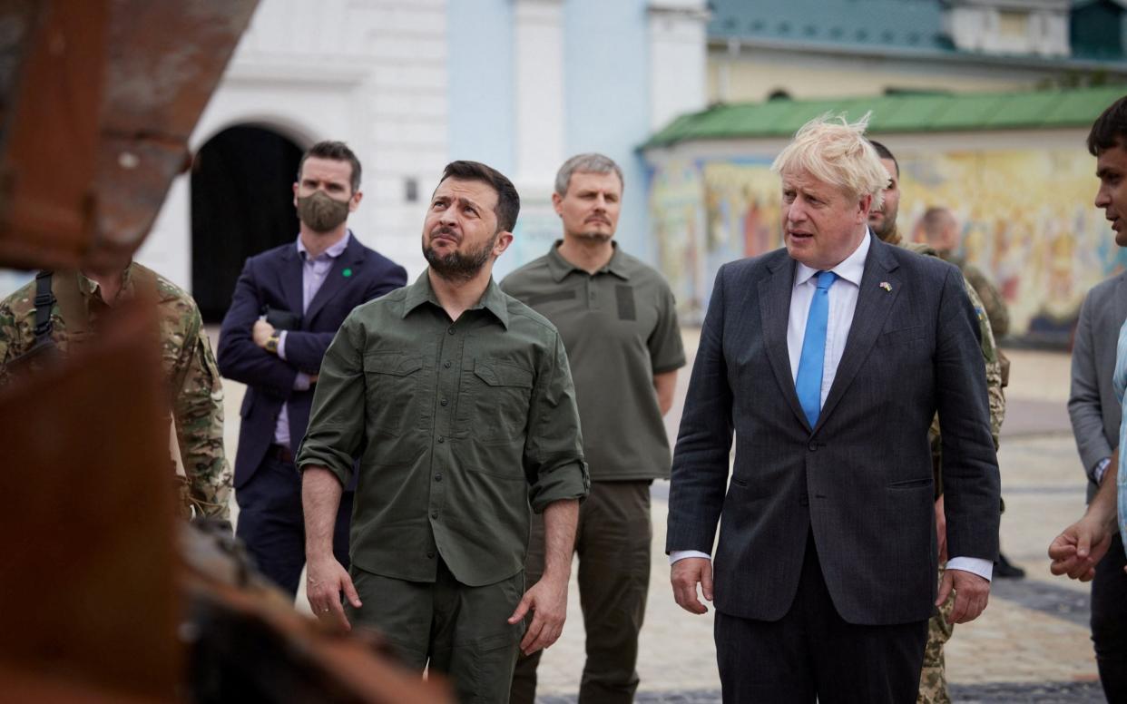 British Prime Minister Boris Johnson and Ukraine's President Volodymyr Zelenskiy visit an exhibition of destroyed Russian military vehicles and weapons, in Kyiv  - Ukrainian Presidential Press Service/Handout via REUTERS