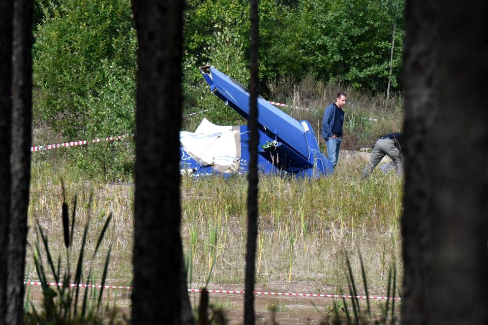 Law enforcement officers work at the site of the alleged Wagner plane crash near the village of Kuzhenkino, Tver region, on August 24, 2023. / Credit: OLGA MALTSEVA/AFP via Getty Images