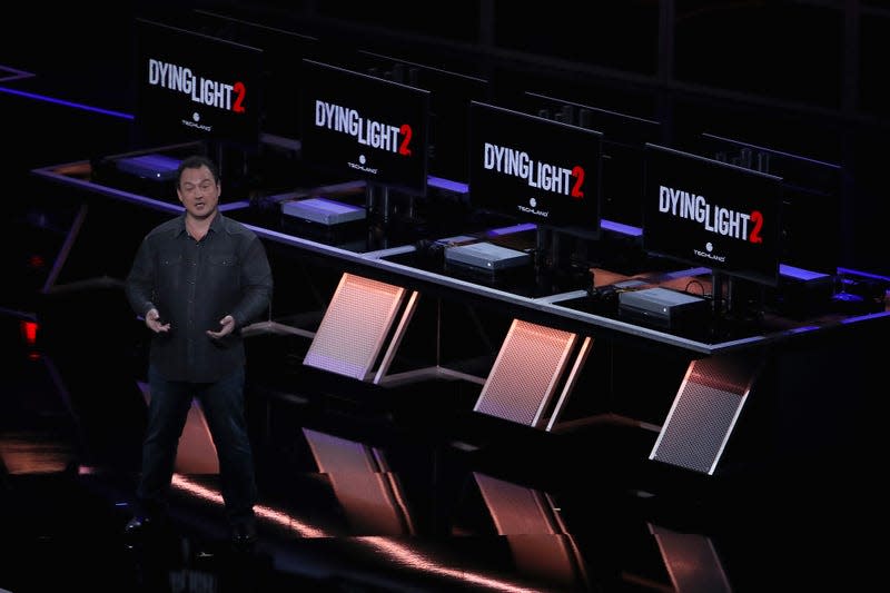 Chris Avellone stands on stage at E3 2018 to present Dying Light 2. 