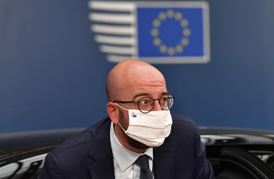 European Council President Charles Michel arrives for an EU summit at the European Council building in Brussels, Sunday, July 19, 2020. Leaders from 27 European Union nations meet face-to-face for a third day to assess an overall budget and recovery package spread over seven years estimated at some 1.75 trillion to 1.85 trillion euros. (John Thys, Pool Photo via AP)