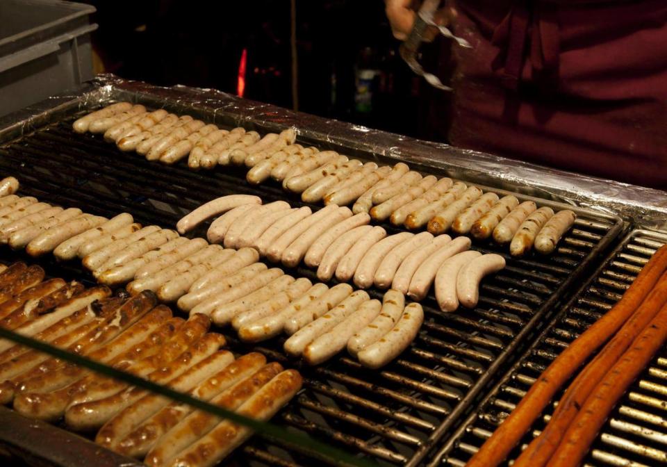 For an authentic German Christmas experience, grab a bratwurst and a Weissbeer to wash it down (iStock)