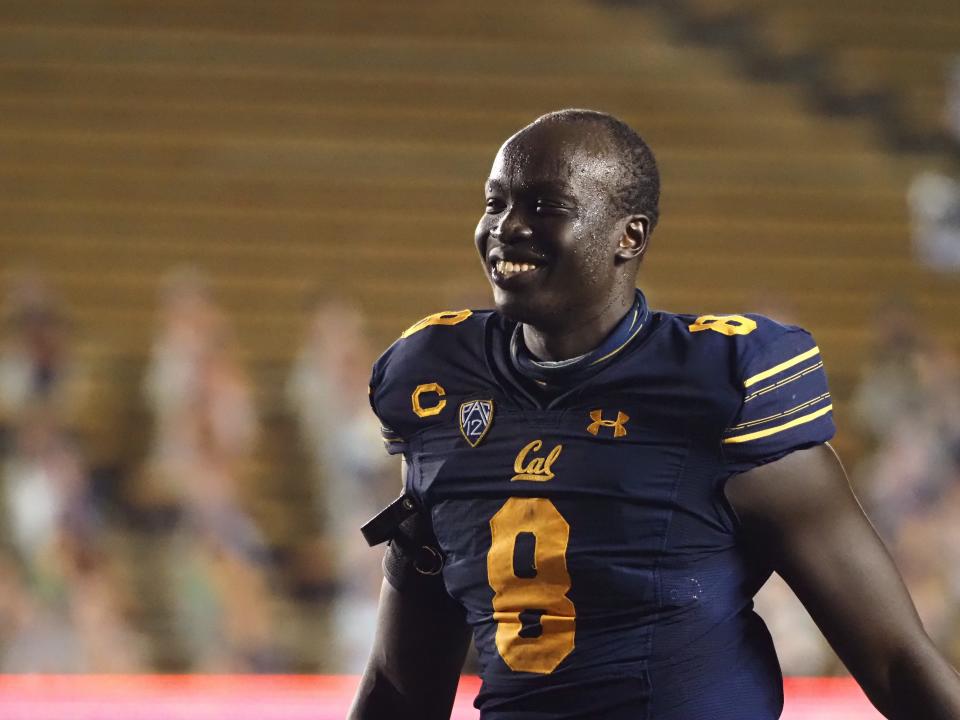 California Golden Bears linebacker Kuony Deng (8) smiles after defeating the Oregon Ducks.