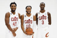 Cleveland Cavaliers guard Donovan Mitchell (45), Darius Garland (10) and Caris LeVert (3) pose for a portrait during the NBA basketball team's media day, Monday, Sept. 26, 2022, in Cleveland. (AP Photo/Ron Schwane)