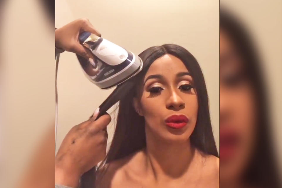 Cardi B’s stylist uses a clothing iron to straighten her hair. (Photo: Instagram/Cardi B)