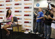HOUSTON, TX - OCTOBER 08: UFC Octagon Girl Arianny Celeste poses for photos with fans at the UFC Fan Expo inside the George R. Brown Convention Center on October 8, 2011 in Houston, Texas.