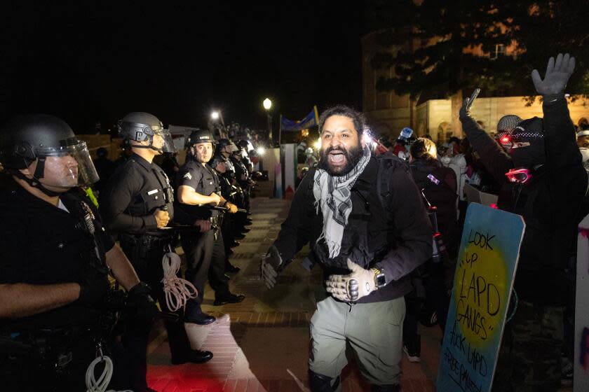 Los Angeles, CA - May 02: Demonstrators occupy a Pro-Palestinian encampment at UCLA as authorities breach and break up the encampment on Thursday, May 2, 2024 in Los Angeles, CA. (Jason Armond / Los Angeles Times)