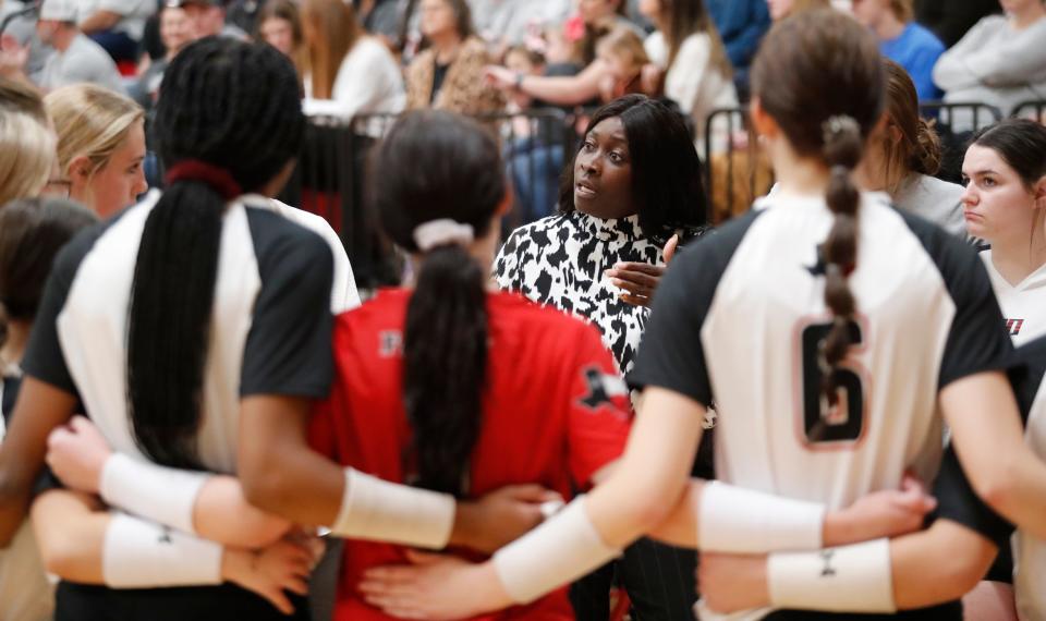 Lubbock Cooper head coach Dana Hill speaks to her players against Colleyville Heritage in the Region I-5A semifinals volleyball match, Friday, Nov. 11, 2022, at Coronado High School. 