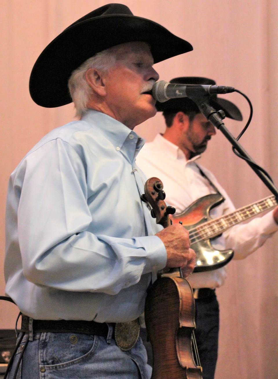 Jody Nix sings, then fiddles during his show last weekend at the Abilene Woman's Club for a Texas-flavored weekend to celebrate Texas Independence Day two days earlier.