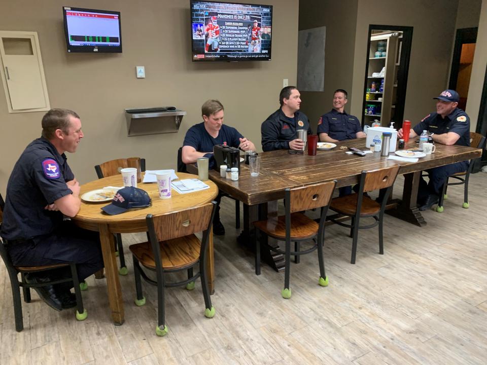 The firefighters of Ladder 8 enjoy lunch cooked by a fellow officer, in between various calls for help.