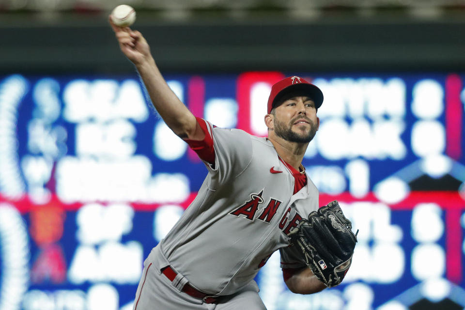 Los Angeles Angels relief pitcher Ryan Tepera throws to a Minnesota Twins pitcher during the ninth inning of a baseball game Friday, Sept. 23, 2022, in Minneapolis. (AP Photo/Bruce Kluckhohn)