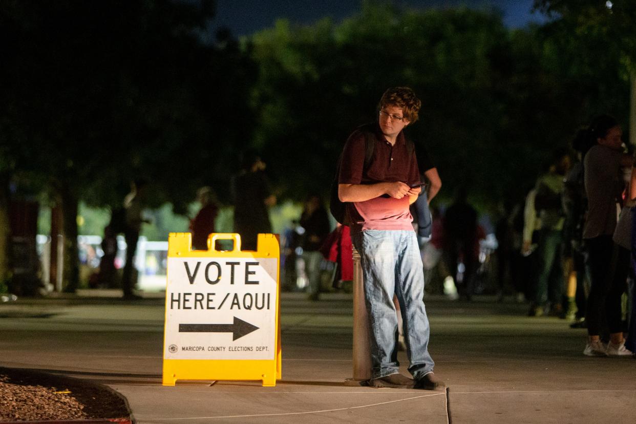 Arizona State University student Spencer Allred waits for a ride at an ASU polling location in Tempe on Nov. 8, 2022.