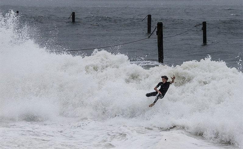 This ruthless surfer was wiped out by a Shark Beach wave when the wild weather hammered Vaucluse on Sunday morning. Getty Images