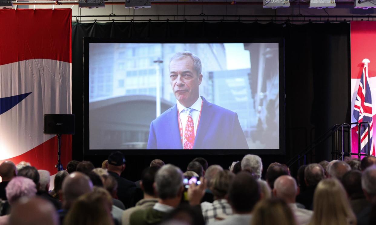 <span>Reform UK co-founder Nigel Farage addresses the Doncaster rally in a prerecorded video message.</span><span>Photograph: Adam Vaughan/EPA</span>