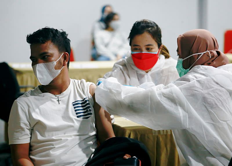 FILE PHOTO: Mass vaccination program for domestic flight passengers at Soekarno-Hatta International Airport, in Tangerang