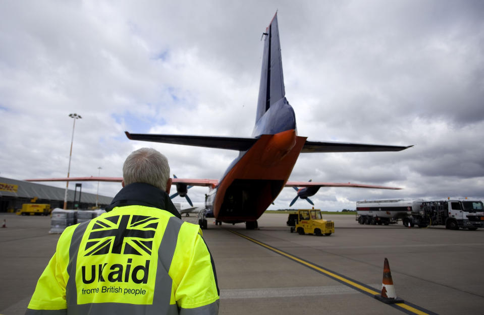 File photo dated 13/8/2014 of staff from UK Aid watch as cargo is loaded on to an Antonov An-12B aircraft at East Midlands Airport as part of the UK Government's humanitarian response to the crisis in Iraq. Britain has hit the United Nations target of spending 0.7\% of national income on aid for the third year in succession, according to figures from the Department for International Development.