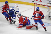 Tampa Bay Lightning's Tyler Johnson (9) scores on Montreal Canadiens goaltender Carey Price (31) as Canadiens' Erik Gustafsson (32) and Ben Chiarot (8) defend during the third period of Game 3 of the NHL hockey Stanley Cup Final, Friday, July 2, 2021, in Montreal. (Ryan Remiorz/The Canadian Press via AP)