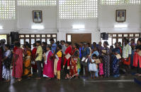 <p>Flood affected victims stand in a queue for food at a relief camp set up inside a school in Kochi, in the southern Indian state of Kerala, Thursday, Aug. 23, 2018. A political battle is brewing in flood-ravaged south India, with the ruling party in Kerala state protesting the central government’s refusal to accept more than $100 million in foreign relief. (AP Photo/Aijaz Rahi) </p>