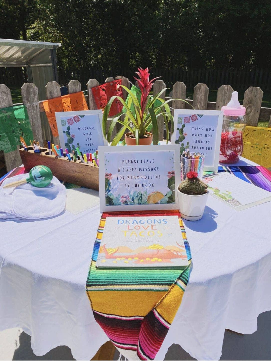 a fiesta table, a great baby shower idea, complete with cacti and a copy of dragons love tacos