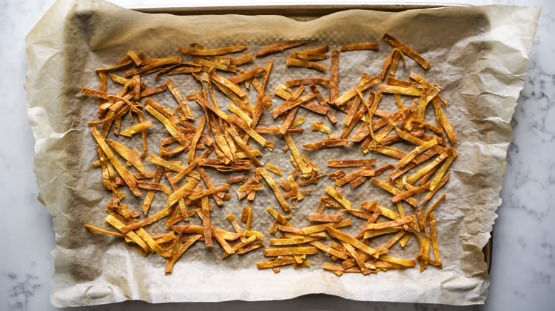 baked tortilla strips on pan