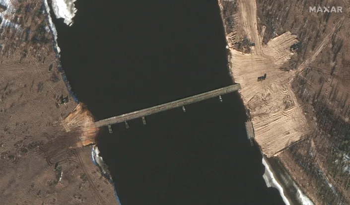 This Feb. 15, 2022 satellite image provided by Maxar Technologies shows an overview of road construction and new pontoon bridge over the Pripyat River, Belarus. (Satellite image ©2022 Maxar Technologies via AP)