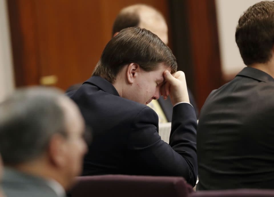 Justin Harris listens as his ex-wife Leanna Taylor testifies during his murder trial. Photo: AP