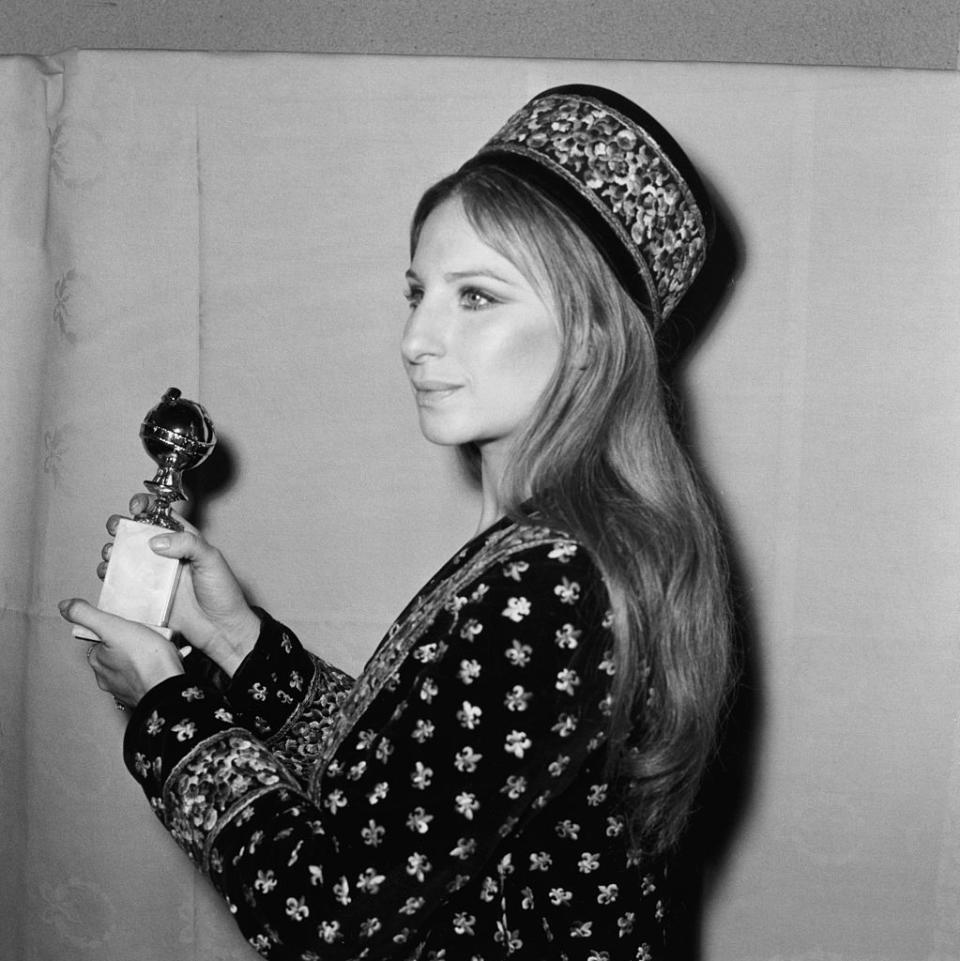 <p>Barba Streisand wearing an embellished long sleeve number and matching hat. </p>