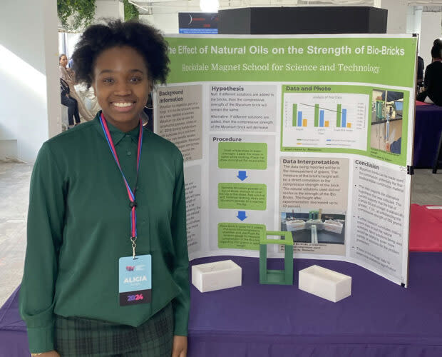 Georgia high schooler Alicia Wright presenting her project “The Effect of Natural Oils on the Strength of Bio-Bricks” at the National STEM Festival. (Joshua Bay/The 74)