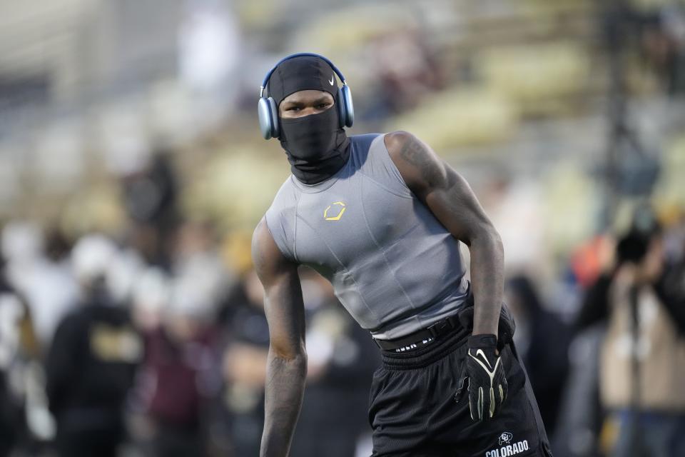 Colorado two-way player Travis Hunter warms up before a game Friday, Oct. 13, 2023, in Boulder, Colo. | David Zalubowski, Associated Press