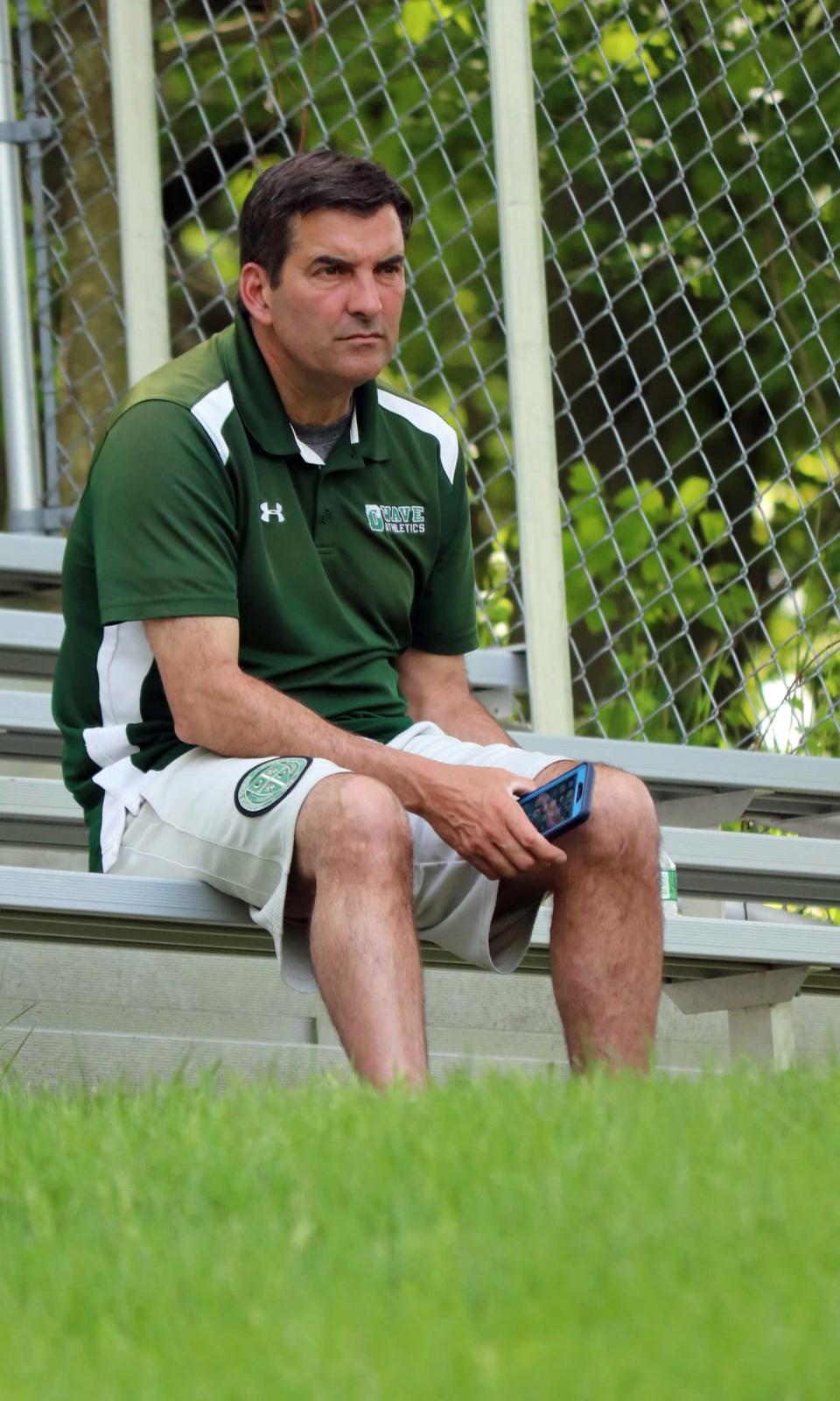 Delbarton tennis coach John Thompson watches his players during the Morris County Tournament.