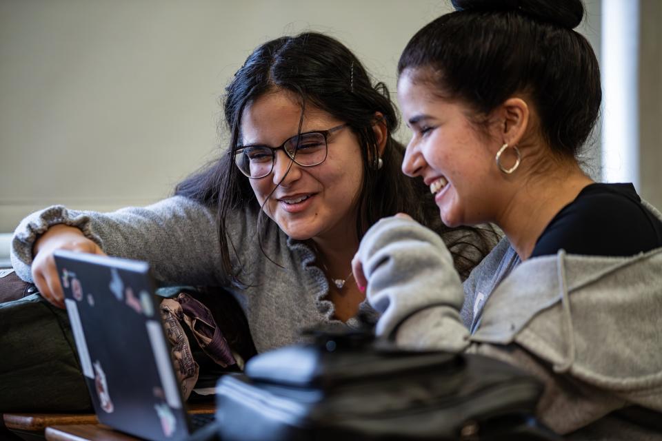Seneca sophomore Sandra Marquez, left, smiled while helping ESL student Rosaura Figuerdo with her lesson during a recent class. Marquez, who is from Cuba, helps other students in her class by translating instructions and helping with communication. March 8, 2024