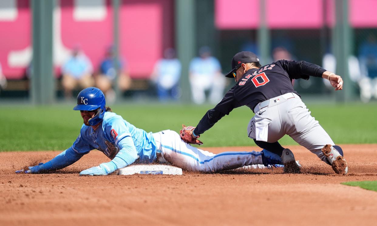 Kansas City Royals designated hitter Bobby Witt Jr. (7) steals second base as Cleveland Guardians second baseman Andres Gimenez (0) applies a tag Monday in Kansas City.