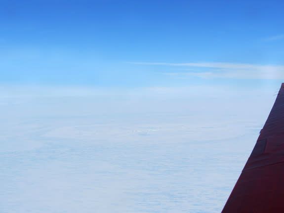 A possible meteorite impact site on the King Baudouin Ice Shelf, seen here from a plane, is more than 1 mile (2 kilometers) wide.