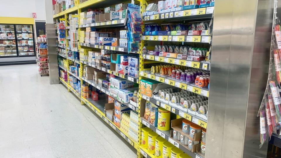 Nearly empty supermarket tablets. See shelves with noticeable empty spaces in a grocery store in La Prairie, Quebec on 13 Feb 2022.