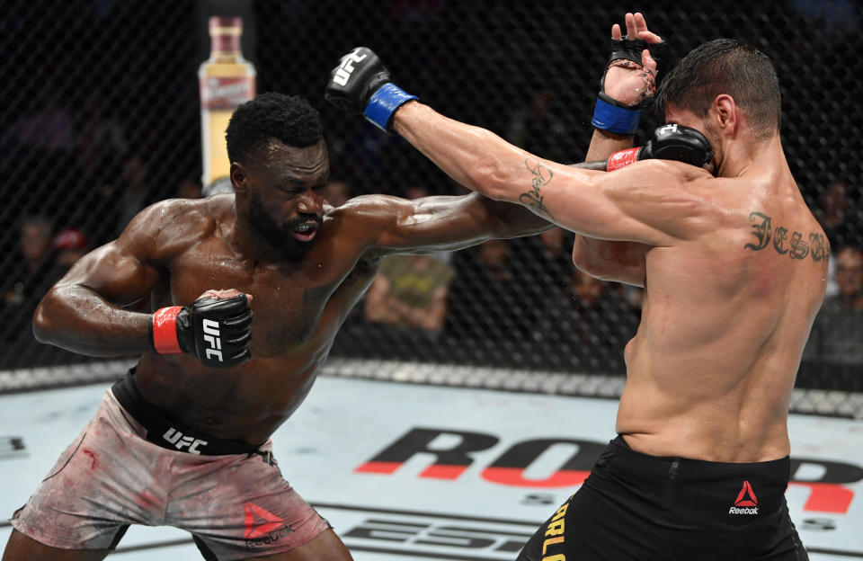 VANCOUVER, BRITISH COLUMBIA - SEPTEMBER 14:  (L-R) Uriah Hall of Jamaica punches Antonio Carlos Junior of Brazil in their middleweight bout during the UFC Fight Night event at Rogers Arena on September 14, 2019 in Vancouver, Canada. (Photo by Jeff Bottari/Zuffa LLC/Zuffa LLC)