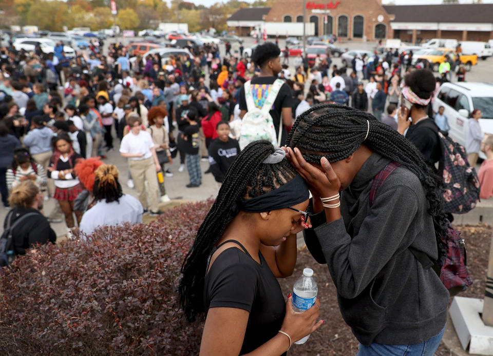 Students stand in a parking lot near the Central Visual and Performing Arts High School after a reported shooting at the school in St. Louis, on Oct. 24.<span class="copyright">David Carson—St. Louis Post-Dispatch/AP</span>