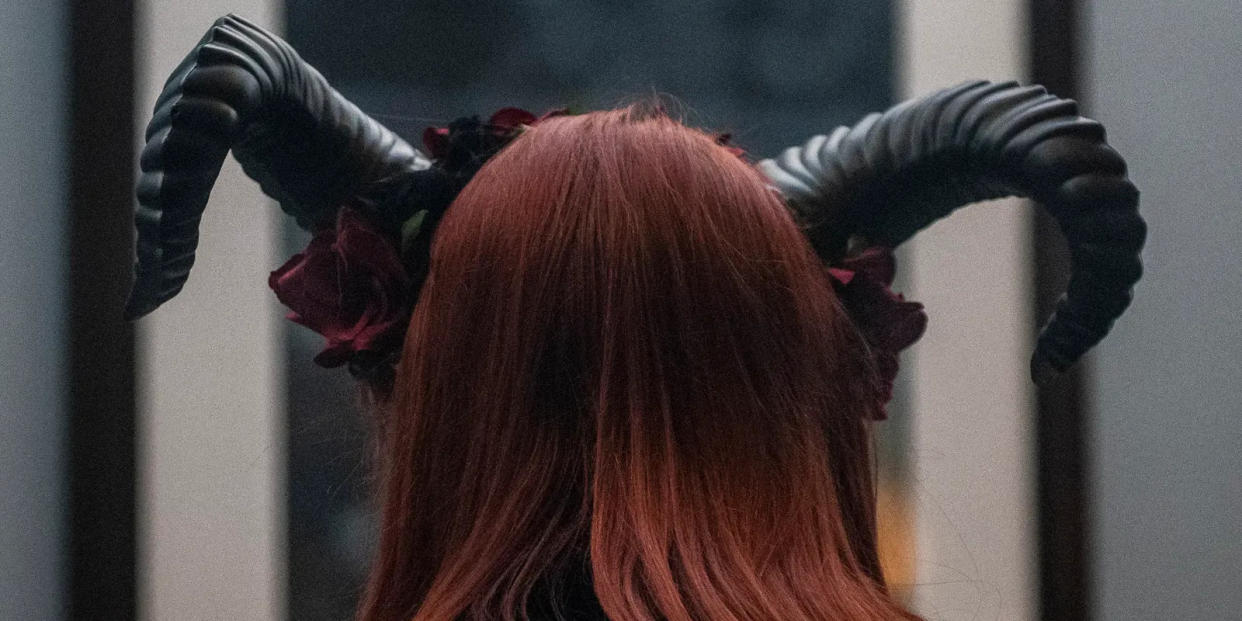 A woman in costume attends SatanCon in Boston last year. SatanCon is an annual convention of the Satanic Temple, which plans to send its chaplains into Florida schools, if requested. The IRS recognizes the temple as a tax-exempt church.