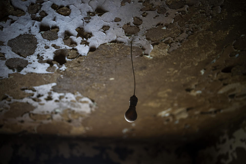 The ceiling of a house at the old village of Aceredo, submerged three decades ago when a hydropower dam flooded the valley, is photographed emerged due to drought at the Lindoso reservoir, in northwestern Spain, Friday, Feb. 11, 2022. Large sections of Spain are experiencing extreme or prolonged drought, with rainfall this winter at only one-third of the average in recent years. The situation is similar in neighboring Portugal, where 45% of the country is now enduring “severe” or “extreme” drought. (AP Photo/Emilio Morenatti)