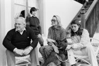 <p>Prince Rainier and Princess Grace Kelly of Monaco relax at their family's ski chalet in Gstaad, Switzerland with their daughters, Stephanie and Caroline, and the family dog in 1979. </p>