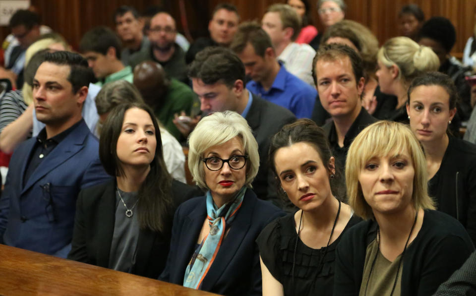 Relatives of Oscar Pistorius wait inside the high court prior to the start of his trial in Pretoria, South Africa, Monday, March 3, 2014. Pistorius is charged with murder with premeditation in the shooting death of girlfriend Reeva Steenkamp in the pre-dawn hours of Valentine's Day 2013. (AP Photo/Themba Hadebe, Pool)