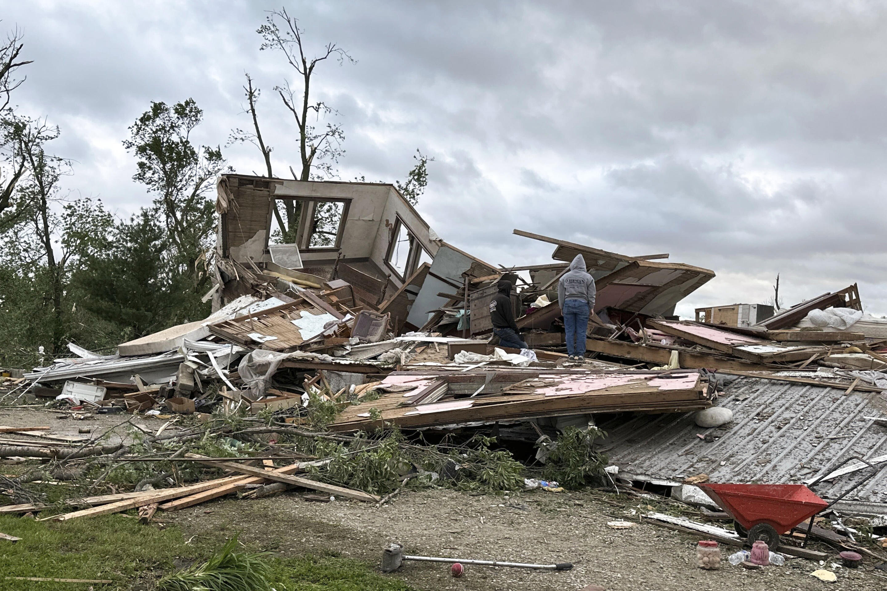 People examine damage after a tornado moved through Greenfield, Iowa, on Tuesday.